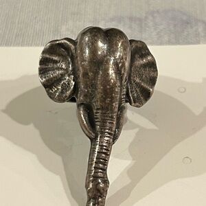 Bronze elephant ring.  Size 8. Flower detail on band. 2” long. 1/2” wide…